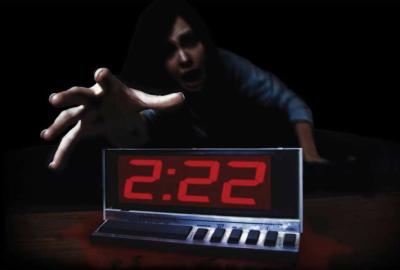 2:22 Woman reaches for her alarm clock