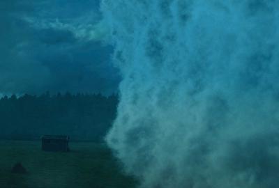 A dense mist approaches an isolated house.
