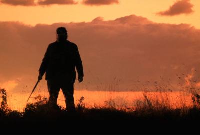 Beyond Twilight man stands with a sword 