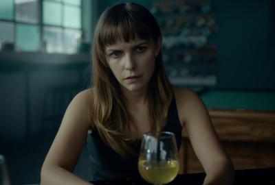 Blind Spot film still woman with a glass of wine