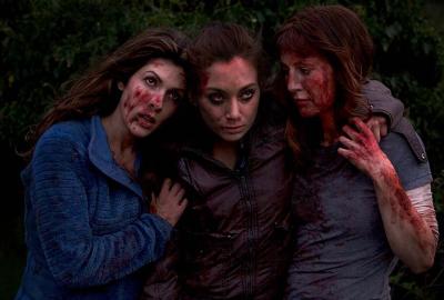 Quarries film still three bloodied women helping each other