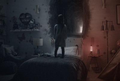 PARANORMAL ACTIVITY: THE GHOST DIMENSION little girl stand on bed looking at a mirrorr