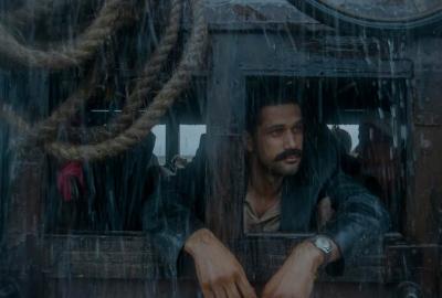 Tumbbad film still man looks out from a stagecoach