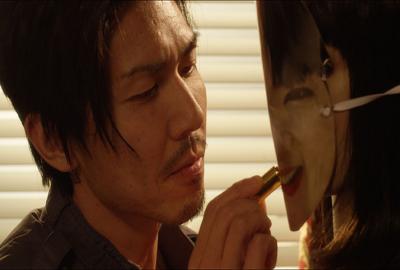 Perfect (Wan Mei) film still man applies lipstick to masked mannequin
