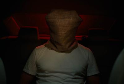 Man's head covered with bag